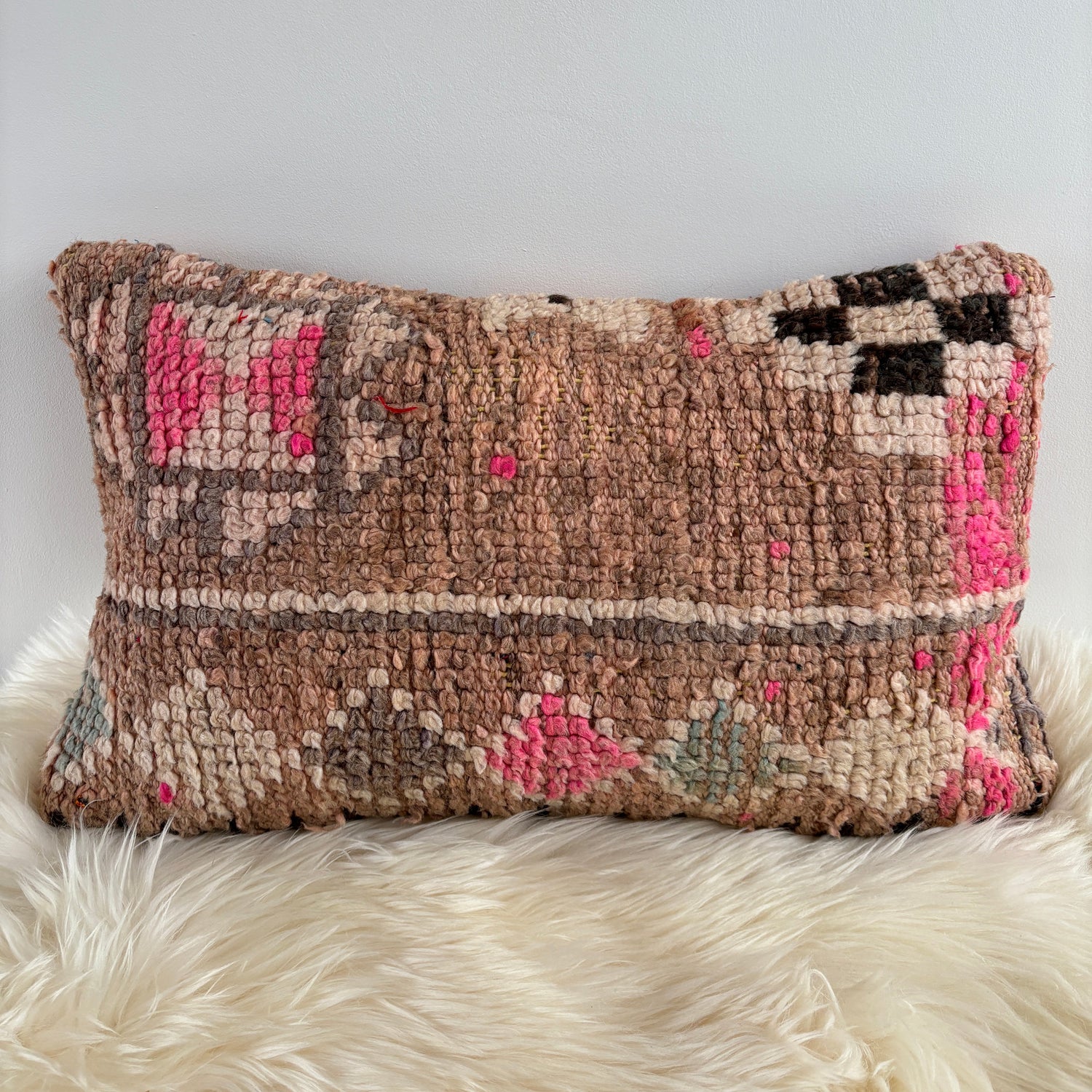 Textured Vintage Boujaad  pillow with geometric pattern on a white surface