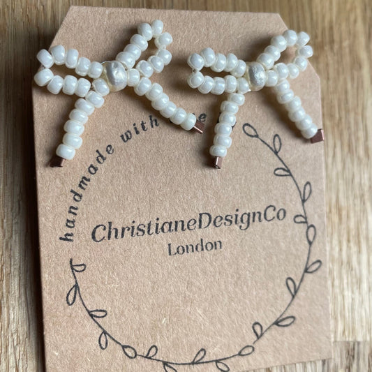 Sterling Silver Medium Bow Stud Earrings with Pearl Style Glass Beads